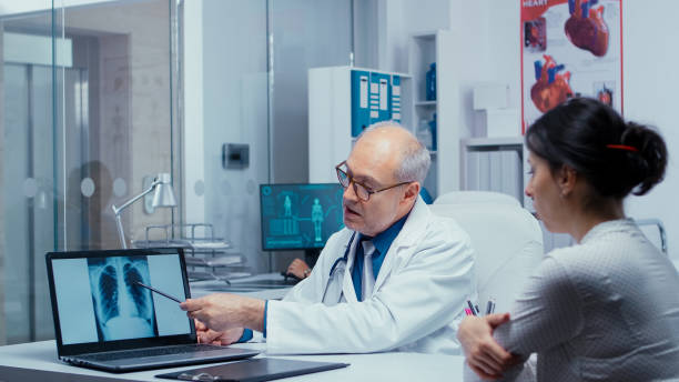 istock Discussing lungs X Ray result with patient 1454144584