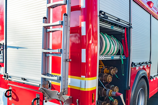 Fire truck with sunlight seen in perspective from behind