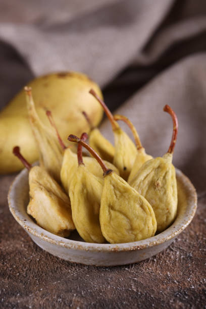 istock dried fruits organic pears on the table, rustic style 1454145036