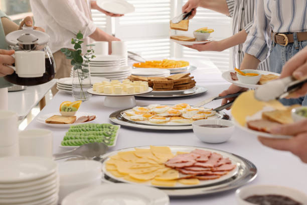istock People taking food during breakfast, closeup. Buffet service 1454145943