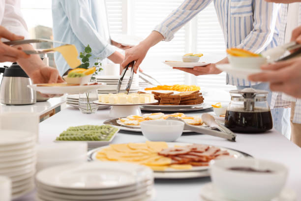 istock People taking food during breakfast, closeup. Buffet service 1454146073