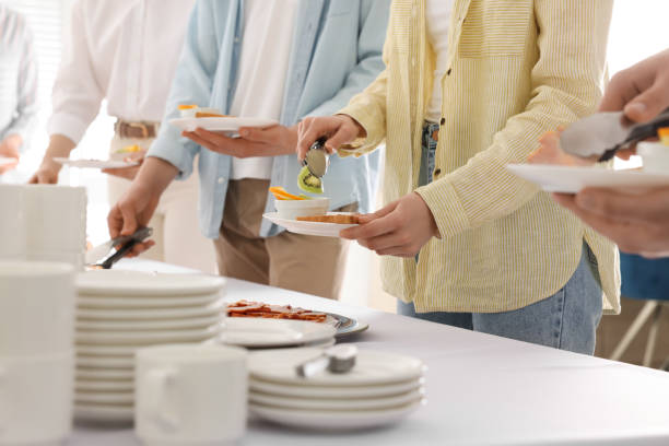 istock People taking food during breakfast, closeup. Buffet service 1454146829
