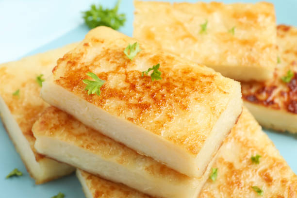 istock Delicious turnip cake with parsley on plate, closeup 1454147224