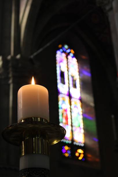 istock Candle in church 1454147356