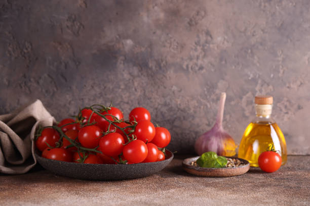 istock food background with tomatoes on a plate 1454147361