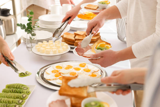 istock People taking food during breakfast, closeup. Buffet service 1454147491