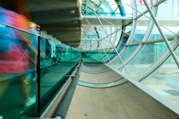 Steel and curved perspex covered walkway and cycle path bridging the Clydeside Expressway (A814), giving access to the Scottish Exhibition and Conference Centre (SECC), Glasgow, Scotland, now known as the Scottish Event Campus (SEC). Popular route for taking pedestrians and cyclists from Exhibition Railway Station to the SEC Centre – five interconnected exhibition and meeting spaces, SEC Armadillo and The OVO Hydro.  The bridge is known colloquially as the  ‘Smartie tube’ and has achieved recognition for its importance as a major city cycle route.
