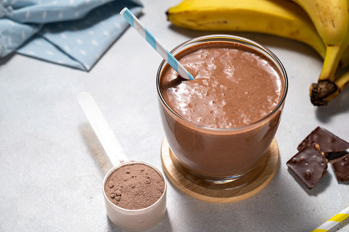 Protein chocolate shake with banana, protein powder and cocoa