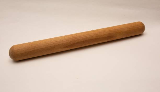 istock Wooden rolling pin isolated on white background 1454149924