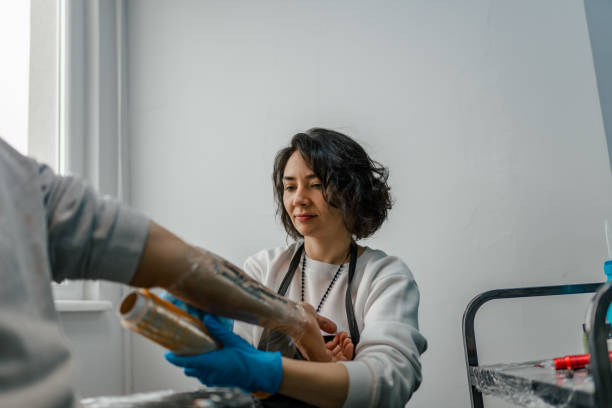 istock Tattoo artist drawing in her studio with latex 1454150463