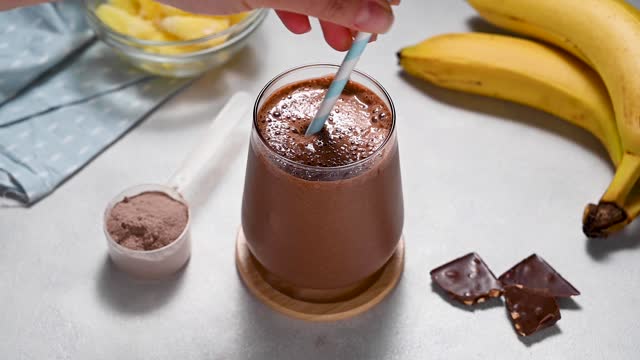 Protein chocolate shake with banana, protein powder and cocoa