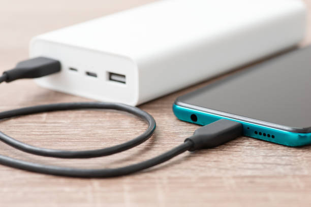 istock Modern smartphone charging from powerbank 1454153205