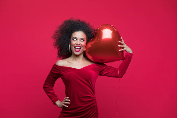 istock Beautiful woman celebrating Valentine's Day 1454154345