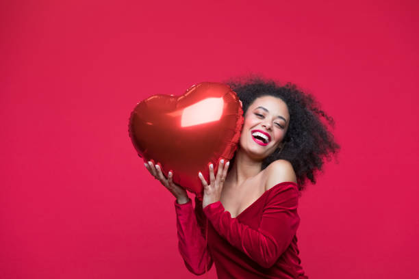 istock Beautiful woman celebrating Valentine's Day 1454154371