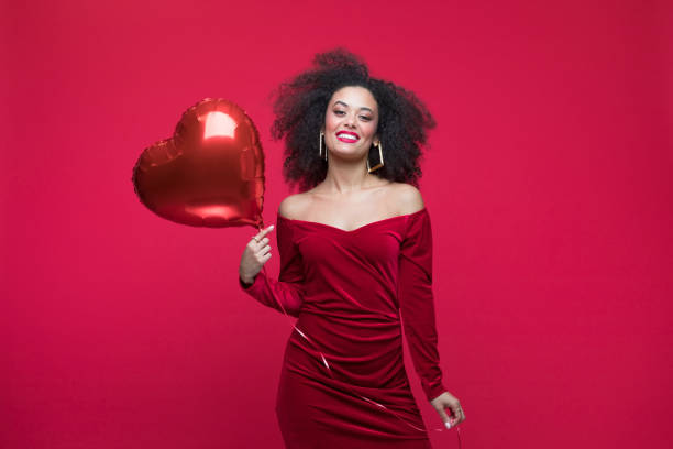 istock Beautiful woman celebrating Valentine's Day 1454154443