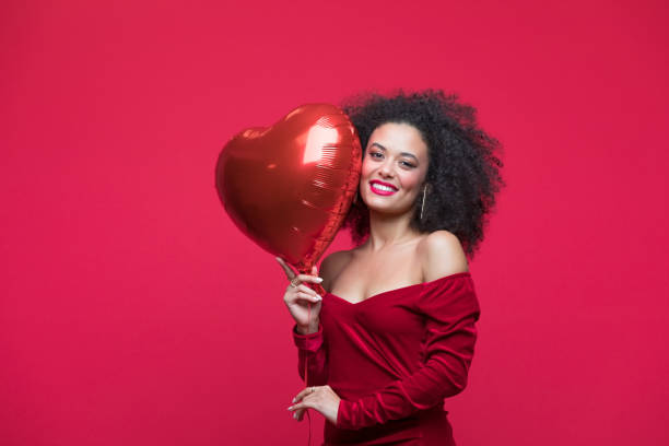 istock Beautiful woman celebrating Valentine's Day 1454154498