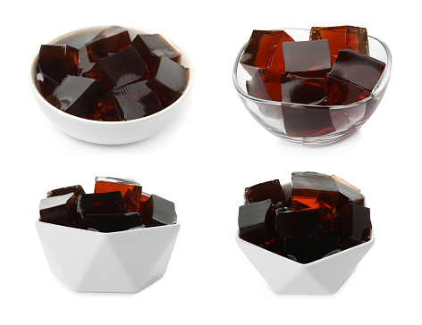 Set with tasty grass jelly cubes on white background