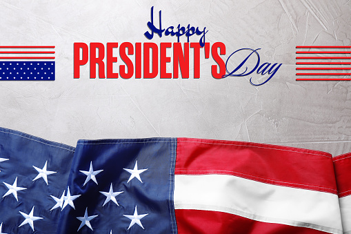 Happy President's Day - federal holiday. American flag and text on stone background, top view