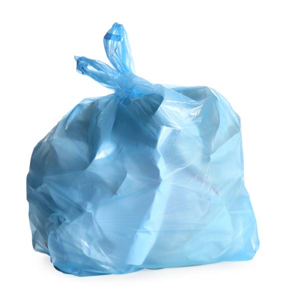 istock Blue trash bag full of garbage isolated on white 1454158769