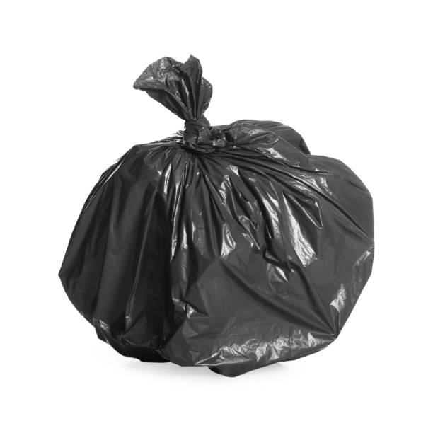 istock Black trash bag full of garbage isolated on white 1454158786