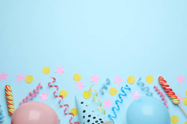 istock Flat lay composition with serpentine streamers and party accessories on light blue background, space for text. Birthday surprise 1454158862