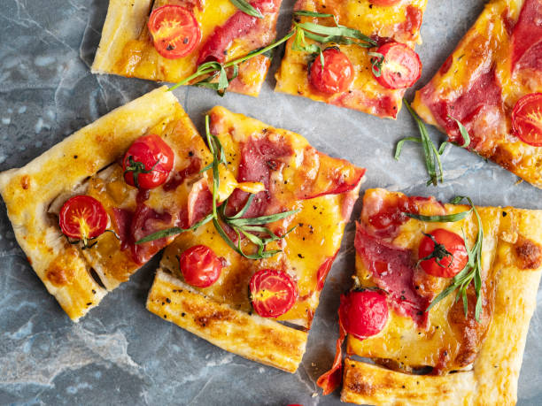 Tomato Tart, Puff pastry pie with tomatoes and meat, Savory Tarts, Tomato Quiche, Homemade pizza stock photo