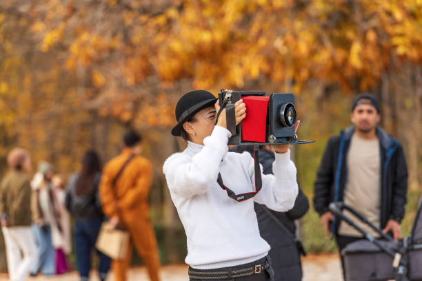 female artistic photographer with fake vintage camera - madrid spain - bellow camera photography photography themes photographer imagens e fotografias de stock