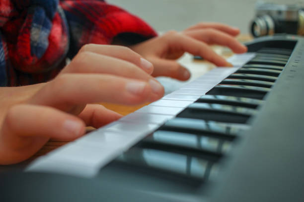 istock playing piano for fun at home 1454162394