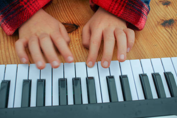 istock playing a toy piano at home 1454162409