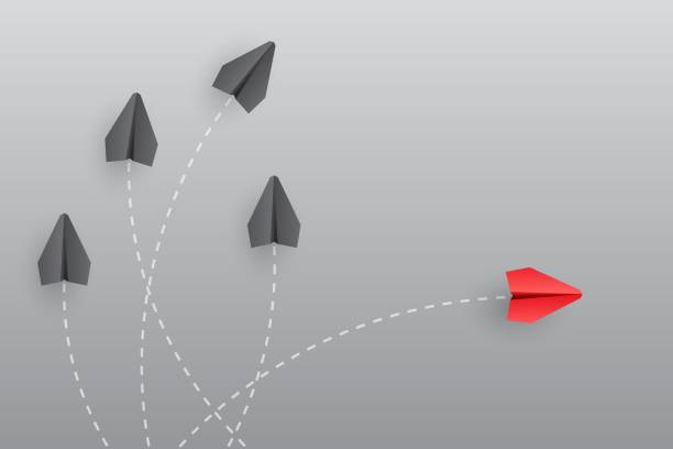 istock Individuality concept. Individual and unique leader red paper plane flies to the side. Think different 1454165528