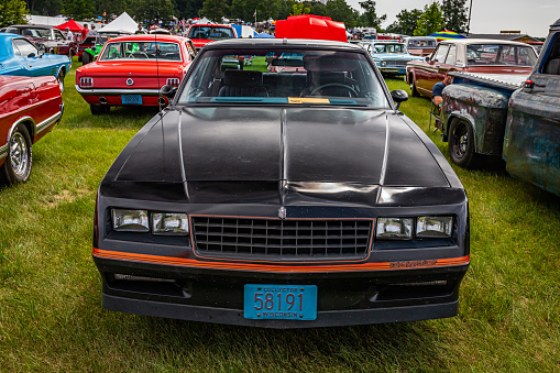 Iola, WI - July 07, 2022: High perspective front view of a 1986 Chevrolet Monte Carlo SS at a local car show.