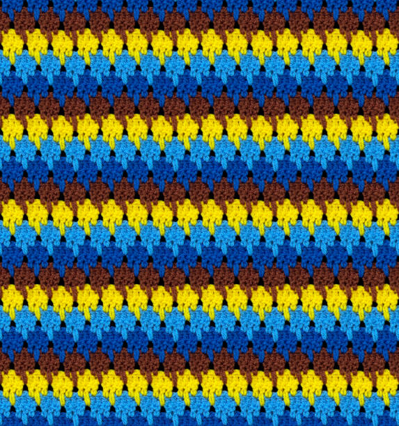 istock Seamless knitted texture. The pattern is crocheted from bright contrasting colors of acrylic yarn. 1454172061
