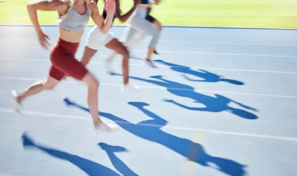 Sports, race and running on track together with athletes in outdoor stadium. Fitness, exercise and blur of people in racing competition for Olympics event. Speed, fast and runners on running track