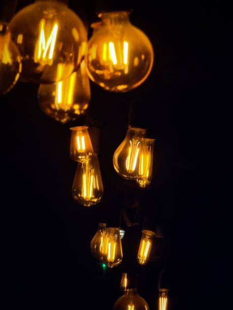 istock Vintage lightbulbs in the dark mood 1454173017
