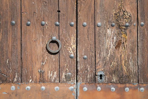A closeup of an old rustic door lock