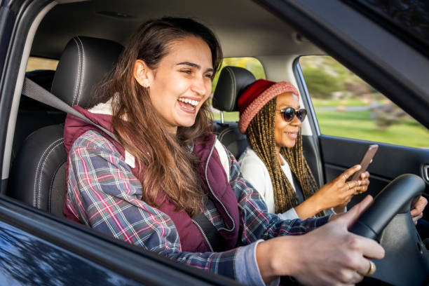 istock Smiling woman going on a road trip with friend 1454173682