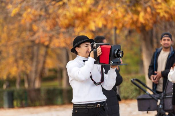 female artistic photographer with fake vintage camera - madrid spain - bellow camera photography photography themes photographer imagens e fotografias de stock