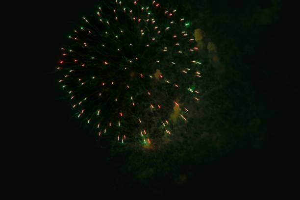 istock Night fireworks against dark sky 1454175057