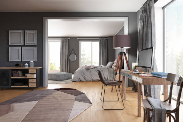 istock Cozy Living Room with a Workspace and Bedroom Design 1454176022