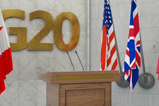 G20 Summit Press Conference or Parliament Speech Concept with Country Flags. 3D Render
