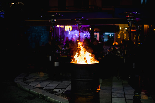 Outdoor Fireplace Burning at Night Party