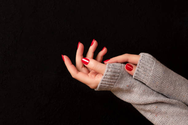 istock Female hands with red nails 1454179786