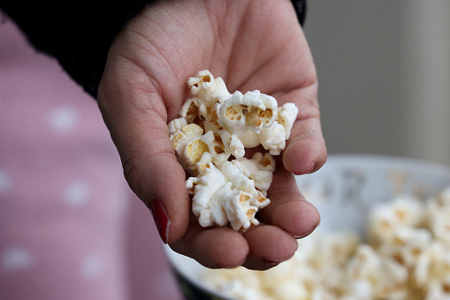 Woman holding popcorn
