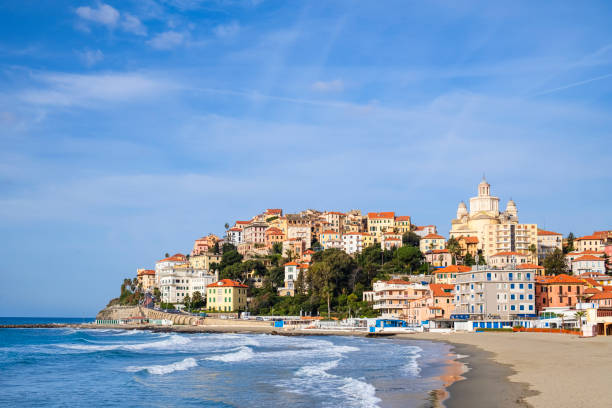 Spiaggia d'Oro - Golden Beach of Imperia, with the borough of Porto Maurizio in background stock photo