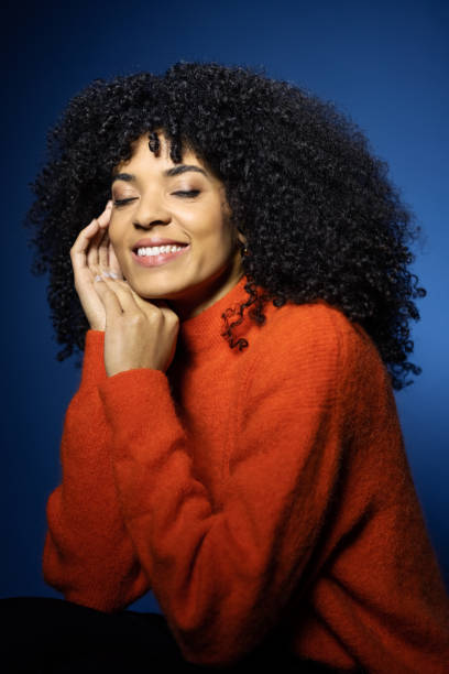 istock Pretty african young woman with closed eyes and relaxed expression 1454185459