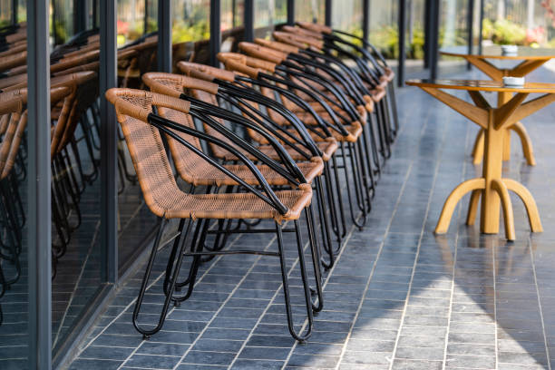 istock Empty chairs and table in street cafe , Vietnam, closeup 1454189864