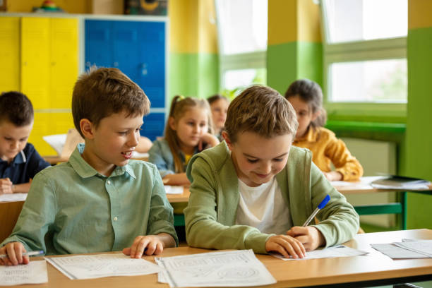 istock School children learning in the classroom 1454190006