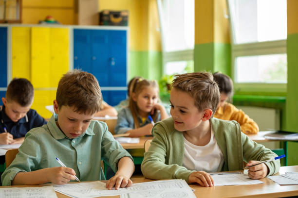 istock School children learning in the classroom 1454190644