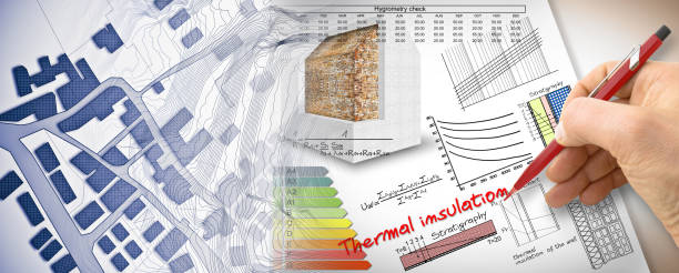 istock Engineer writing formulas and diagrams about thermal insulation and buildings energy efficiency - concept image with city map 1454196949