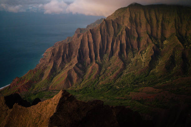 Detail with some spotlights of the Waimea Canyon on the island Kauai at sunset. It is the largest canyon in Hawaii.